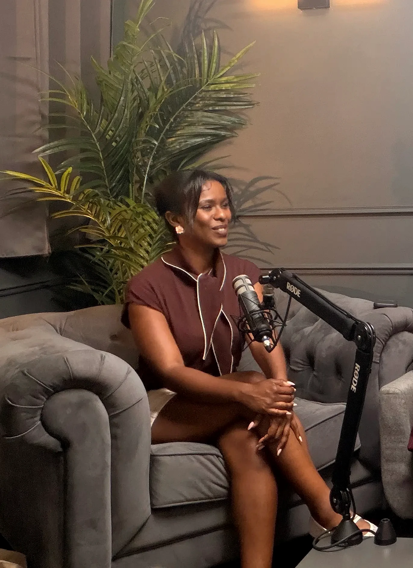 Maria Garcia speaking into a studio microphone