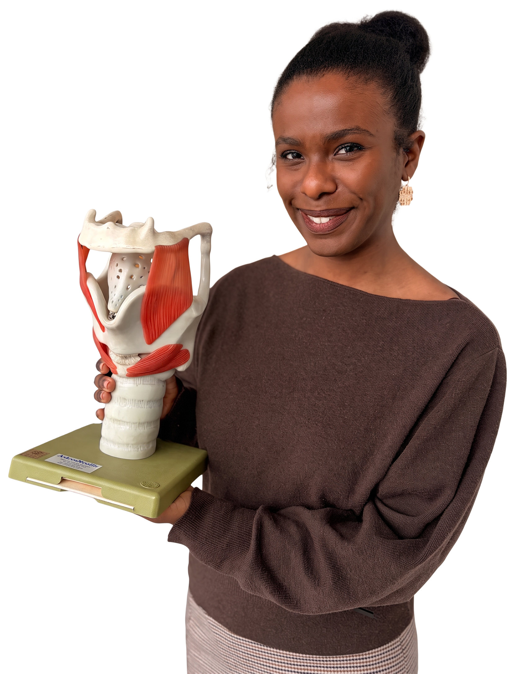 Maria Garcia holding an anatomical model of the larynx